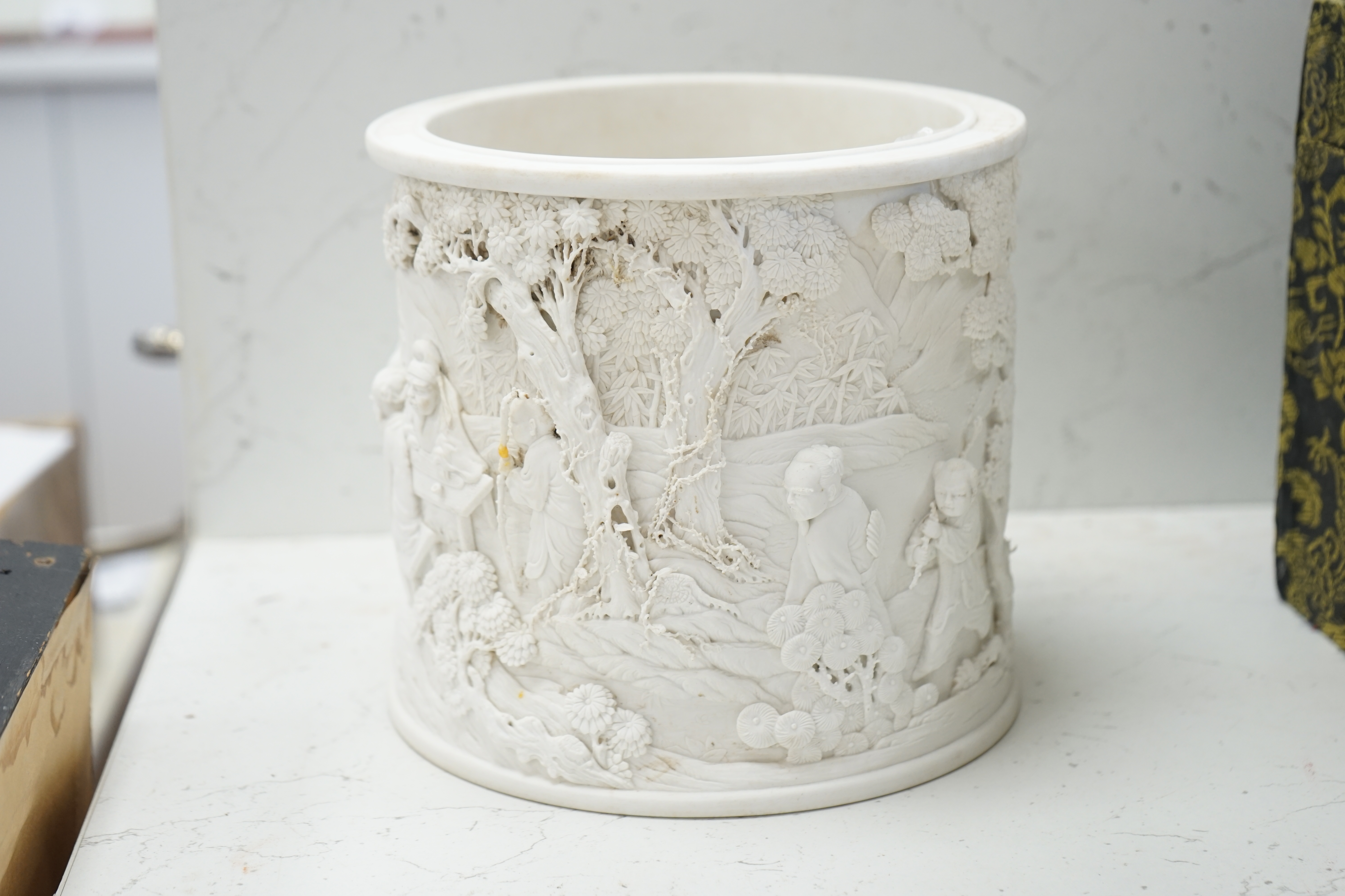 A Chinese biscuit porcelain ‘scholars’ brushpot, Daoguang mark but later, 17cm. Condition - fair to good